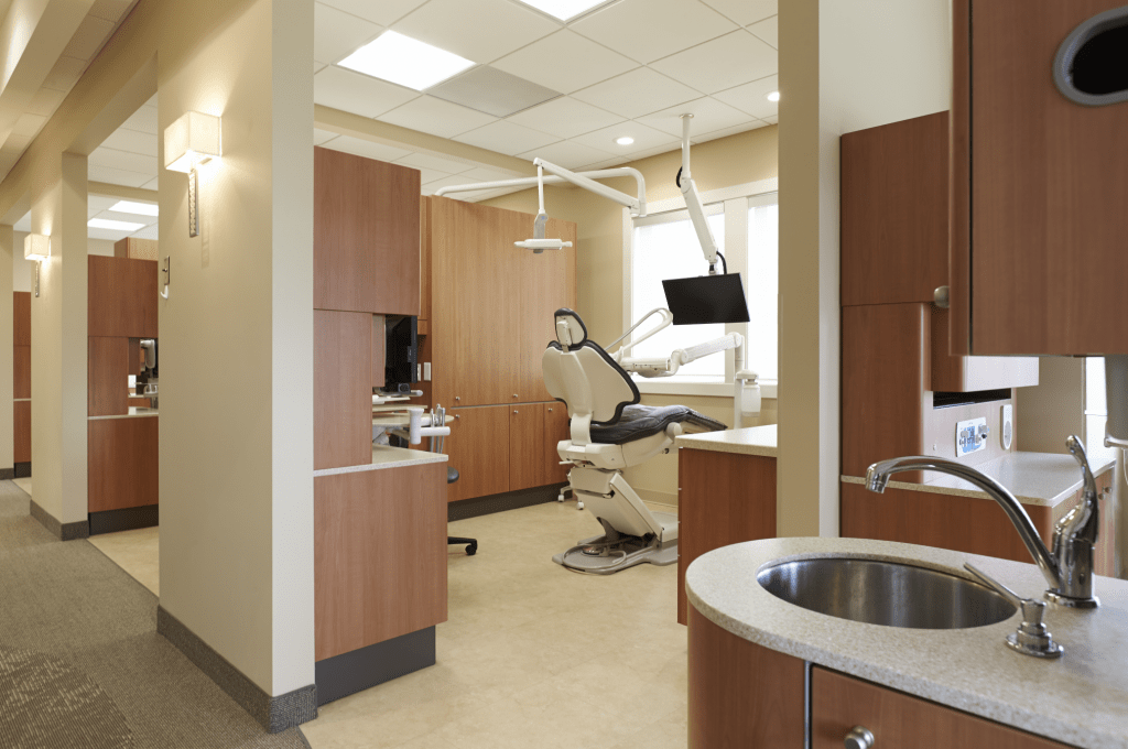Dental exam room with sink in foreground
