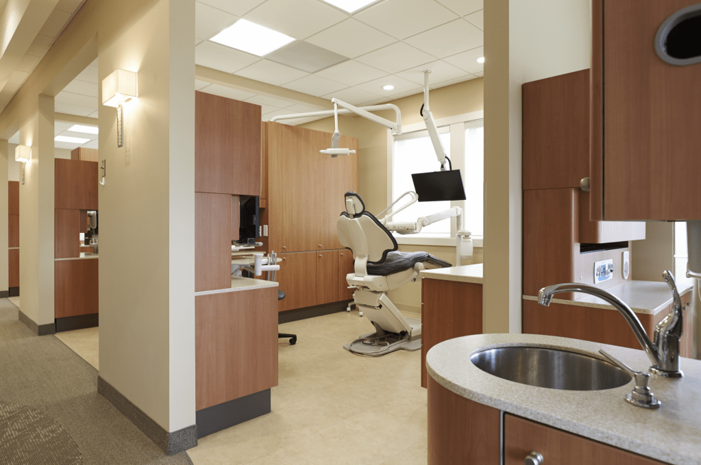 Dental exam room with sink in foreground