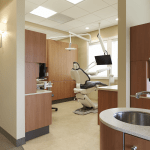Dental exam room with sink in foreground