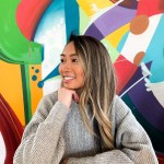 Dr. Meyer smiling with an abstract colored background